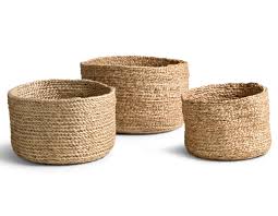 Round Eco-friendly Jute baskets of different sizes on a white background