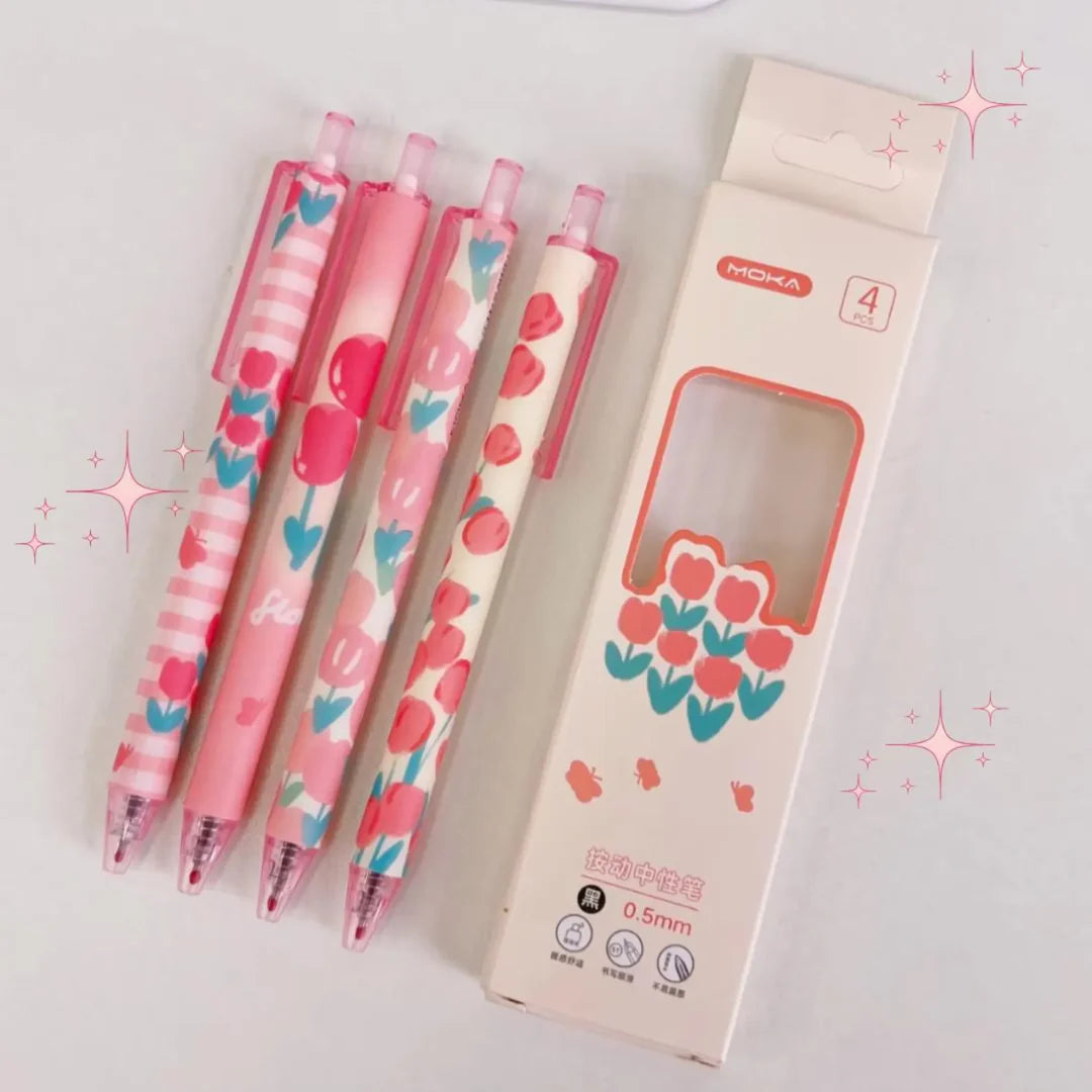 Rose Pink Tulips Pen Set of four floral-patterned ballpoint pens in black ink with a matching box on a light gray background