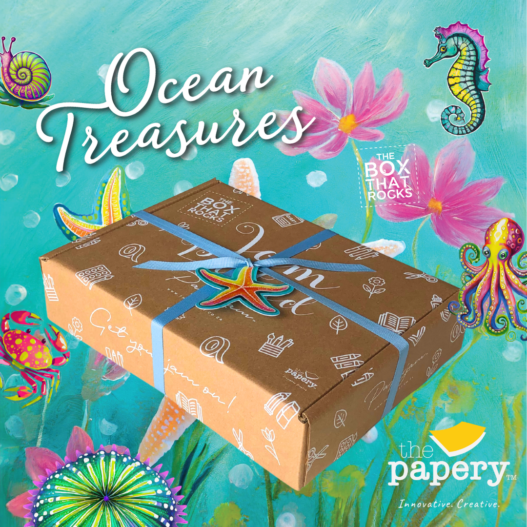 Ocean Treasures Gift box with decorative ribbon on an underwater-themed background with 'Ocean Treasures' text and 'The Papery' branding.