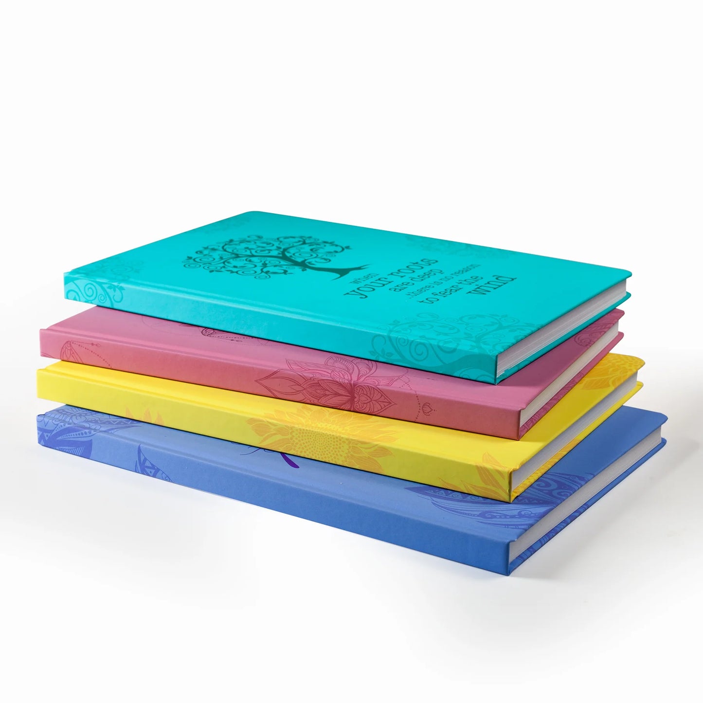Stack of colorful Scribblz A5 Journal with artistic design and with motivational quote on a white background
