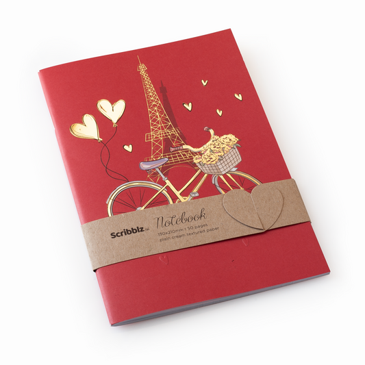 A5 Scribblz notebook with Eiffel Tower and bicycle illustration, featuring plain cream textured paper