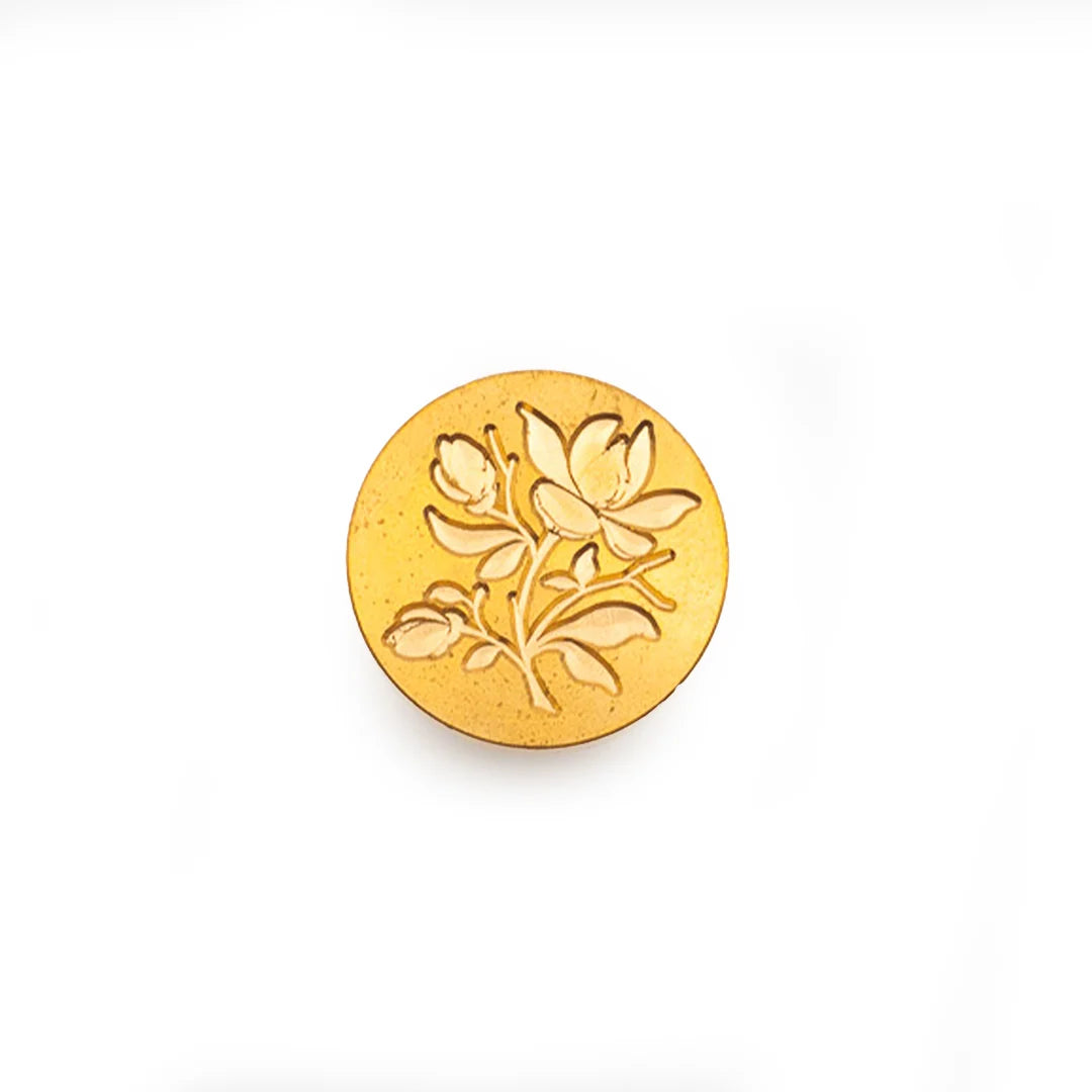 A round gold-toned stamp-seal featuring an embossed floral design, shown on a plain white background.