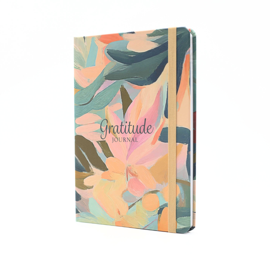 Floral design gratitude journal and matching ribbon with a straight front view on a white background