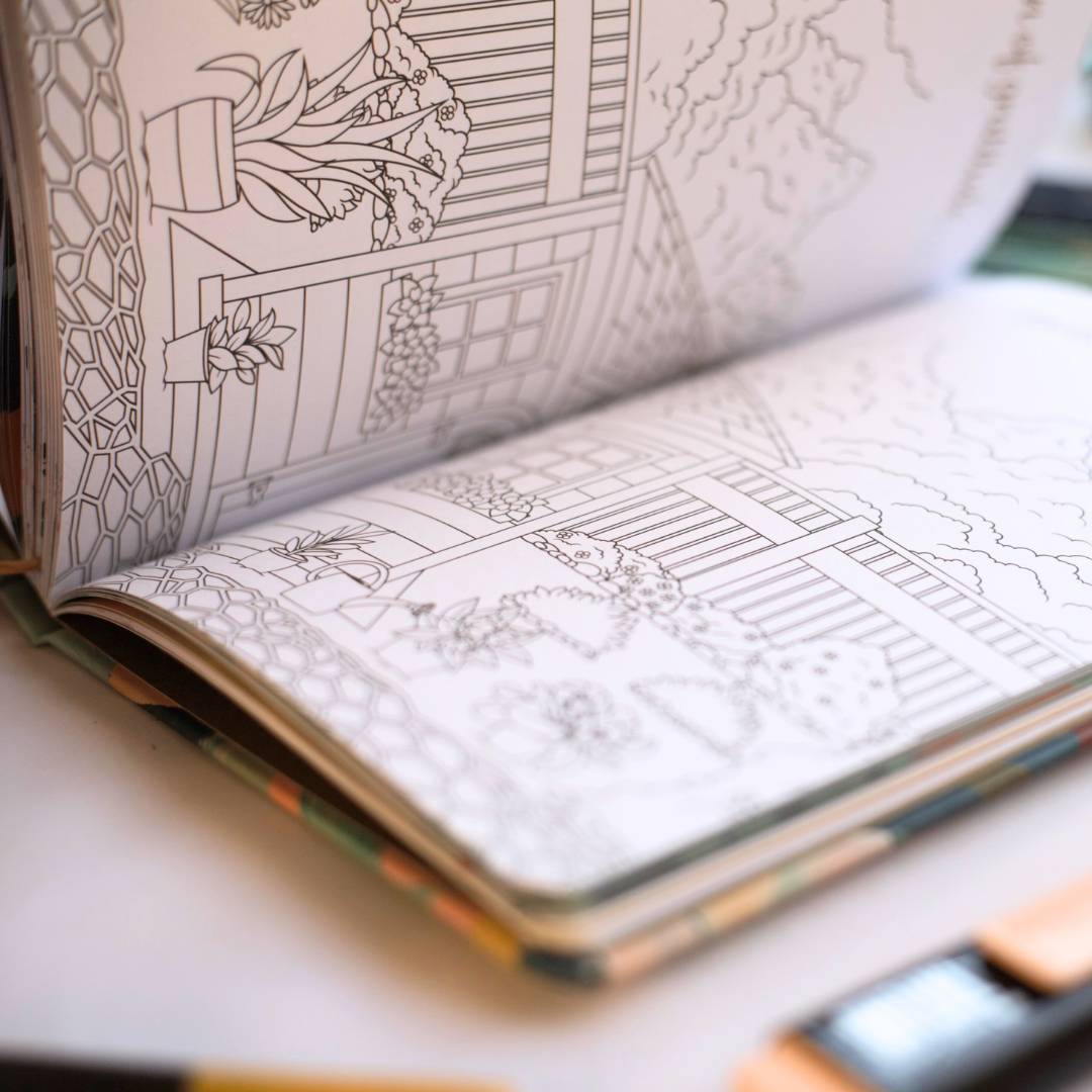 Open garden and nature themed coloring book with black line art on a white surface