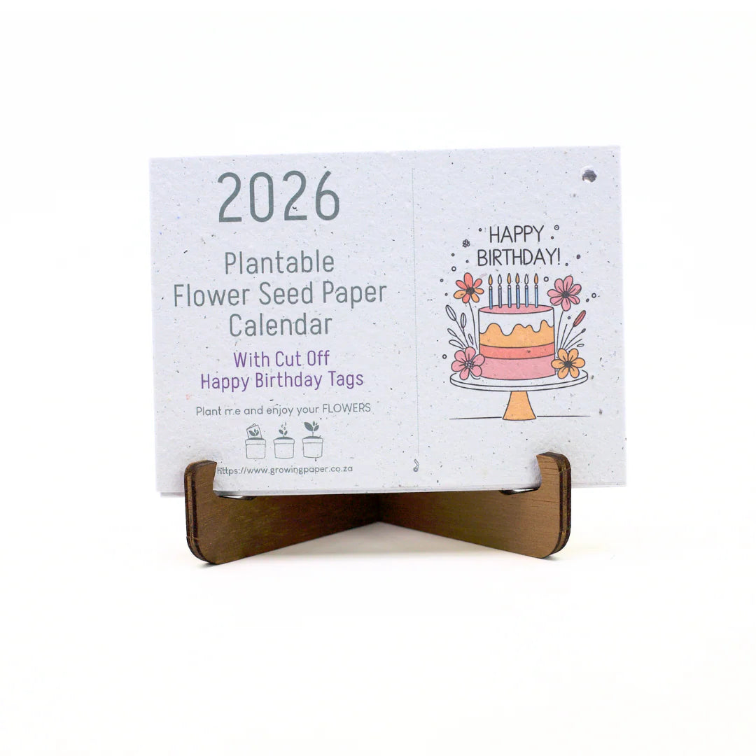 2026 plantable flower seed paper calendar with a birthday cake design on a white background