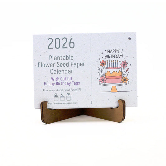 2026 plantable flower seed paper calendar with a birthday cake design on a white background