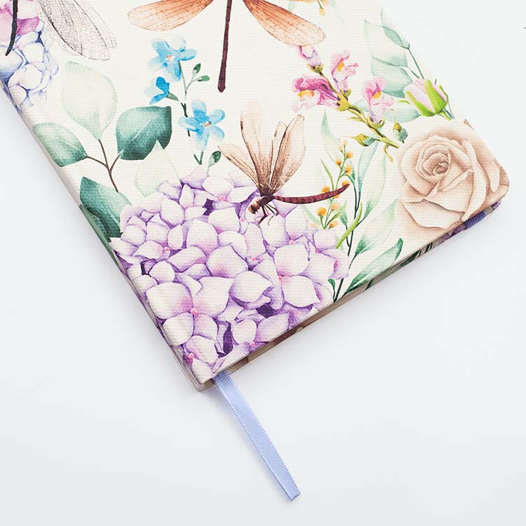 Cover of Insects Hard Cover Journal A5 with dashing dragonflies design featuring matching ribbon on a white background