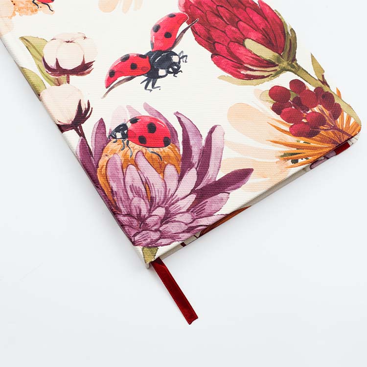 Cover of Insects Hard Cover Journal A5 with luscious ladybugs design featuring matching ribbon on a white background