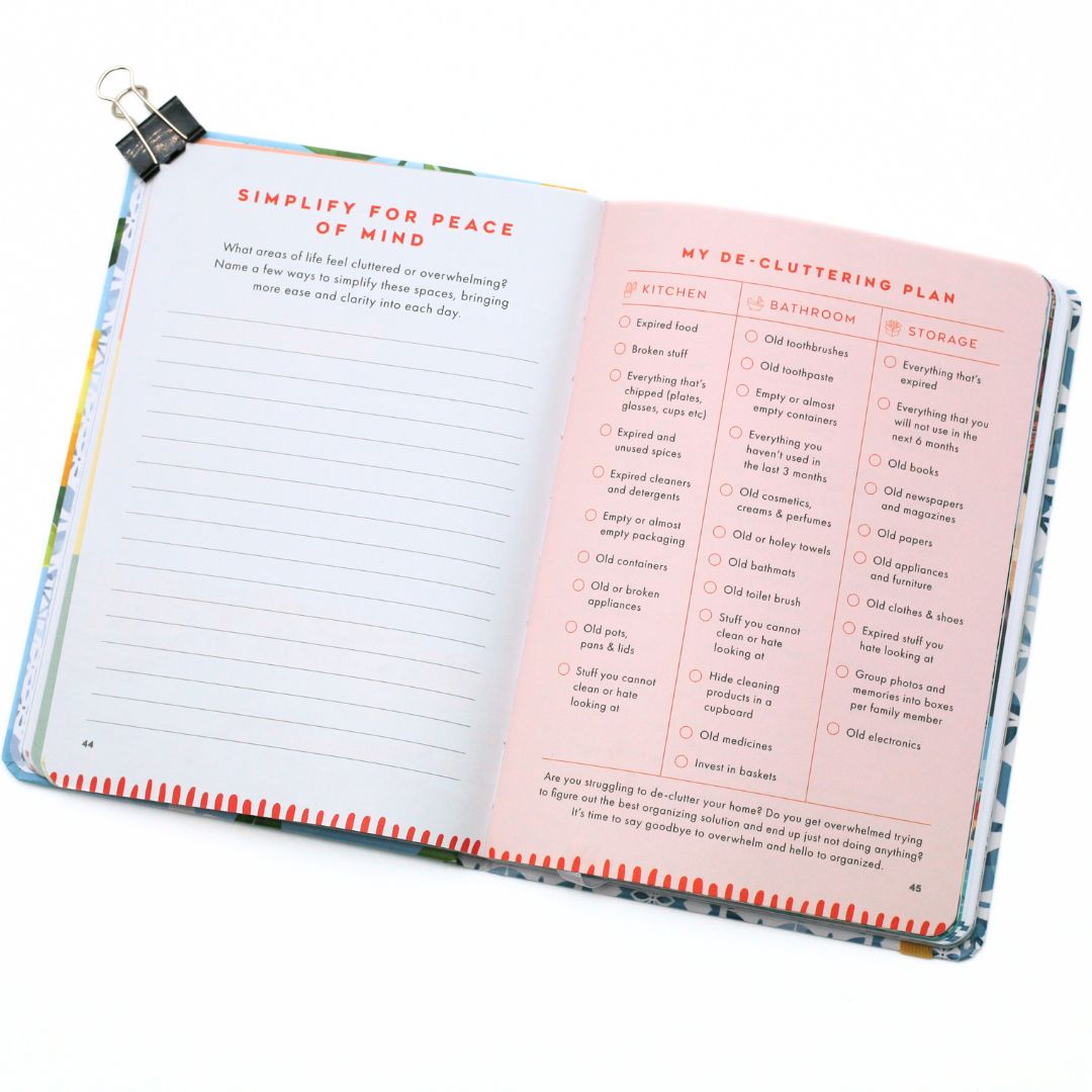Open La Dolce Vita Life is beautiful guided vision Journal with sections on decluttering and organizing, on a white background