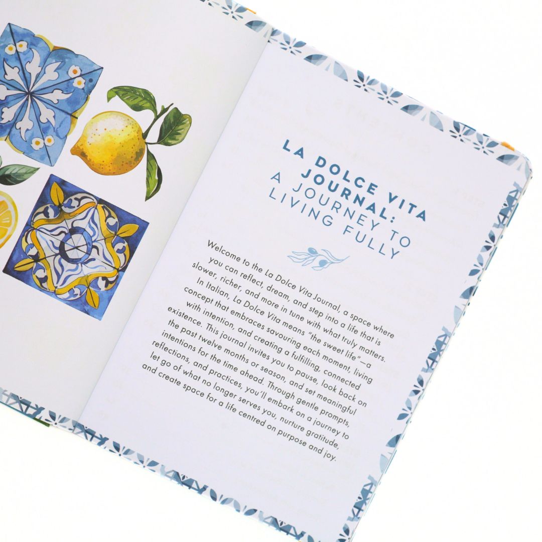 Open La Dolce Vita Life is beautiful guided vision Journal with meaning plus decorative tiles and lemons on a white background
