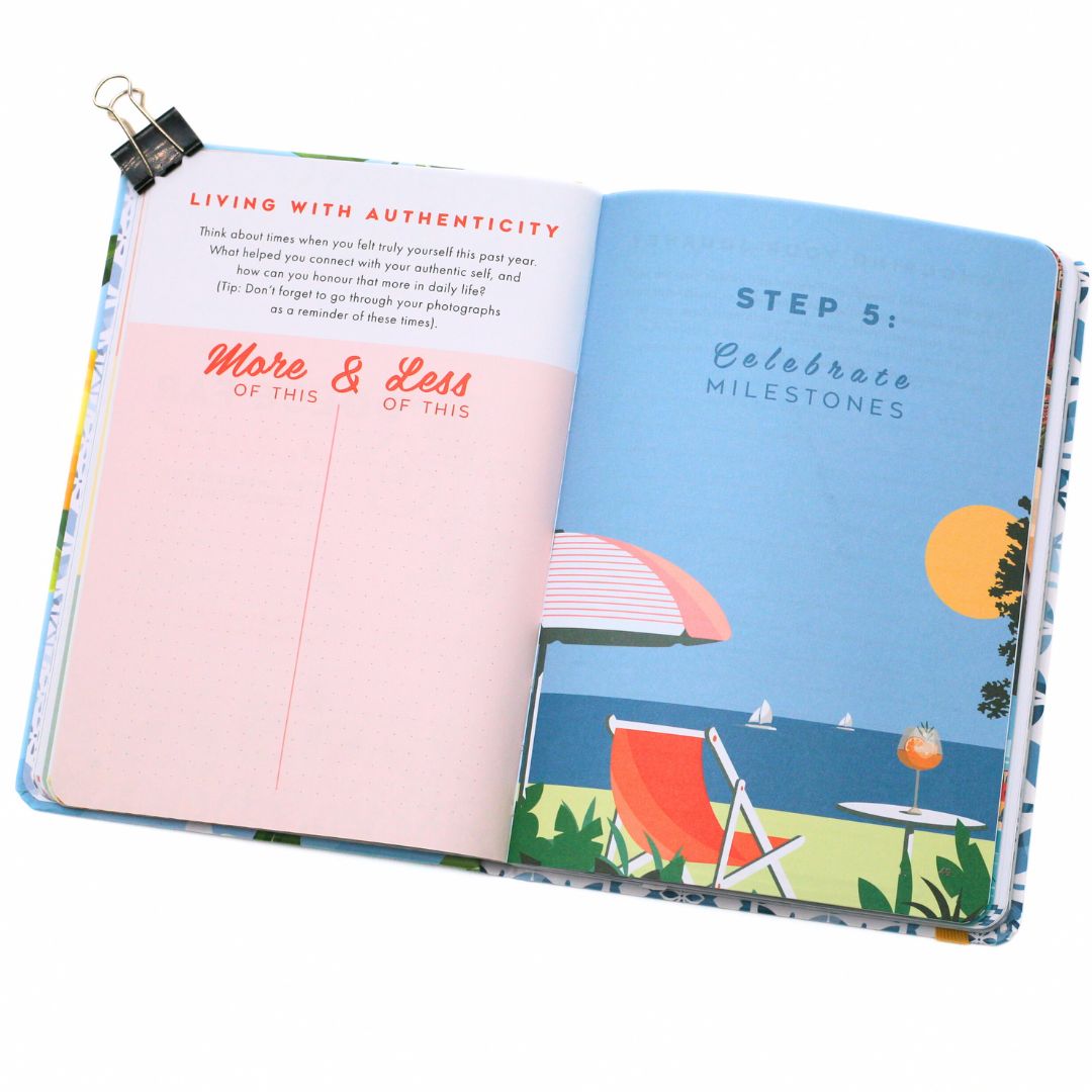 Open La Dolce Vita Life is beautiful guided vision Journal with beach-themed cover and 'More and less of this' pink interior page