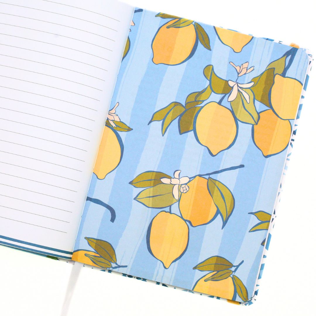 La Dolce Vita Life is beautiful guided vision Journal with inside page of a lemon pattern on a blue background