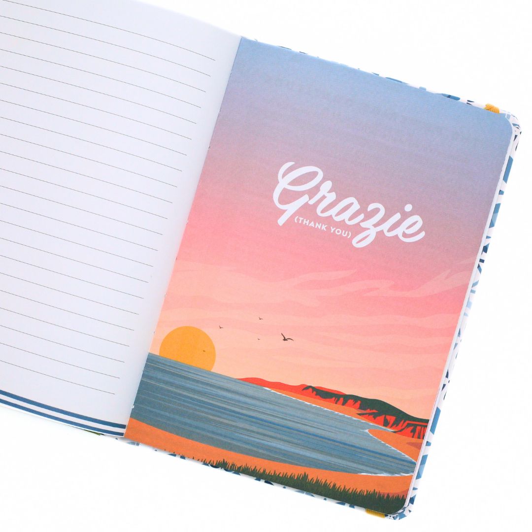 La Dolce Vita Life is beautiful guided vision Journal with a colorful cover featuring a sunset design and the word 'Grazie' on a white background.