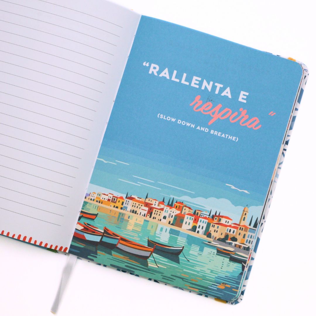 Open La Dolce Vita Life is beautiful guided vision Journal with a scenic cover design on the right and motivational text 'Slow down and breathe' on a white background