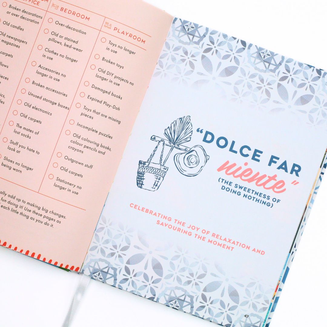Open La Dolce Vita Life is beautiful guided vision Journal with a decorative cover featuring interactive text and illustrations, on a white background.