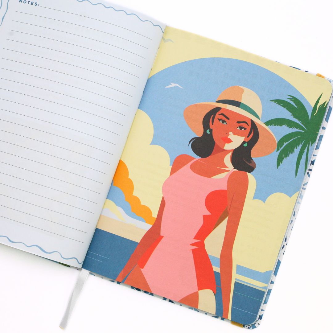 La Dolce Vita Life is beautiful guided vision Journal with a colorful cover featuring a woman in a beach scene, open to reveal lined pages.