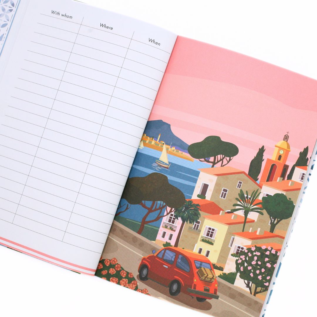Open La Dolce Vita Life is beautiful guided vision Journal with illustrated cover of a coastal scene and grid pages.