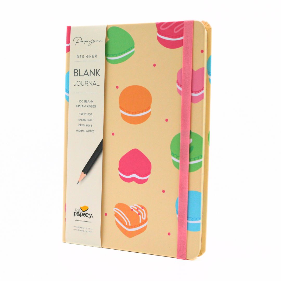 Papergoo Designer Blank Journal with a cream-colored cover decorated with colorful macaron illustrations, featuring a pink elastic closure band and a matching paper sleeve.