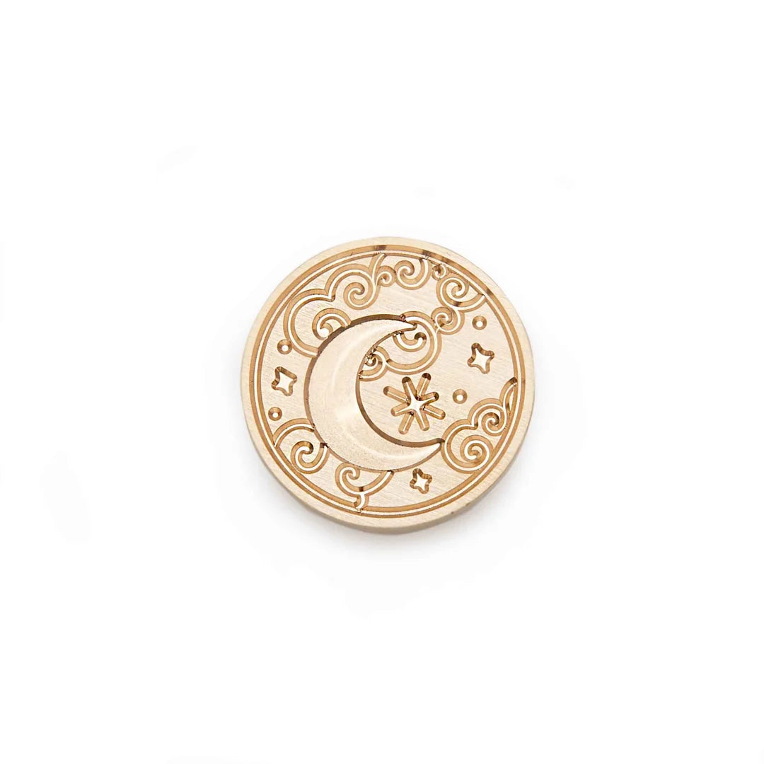 A round wooden stamp-seal with a carved crescent moon, star, and scroll pattern, shown on a plain white background.