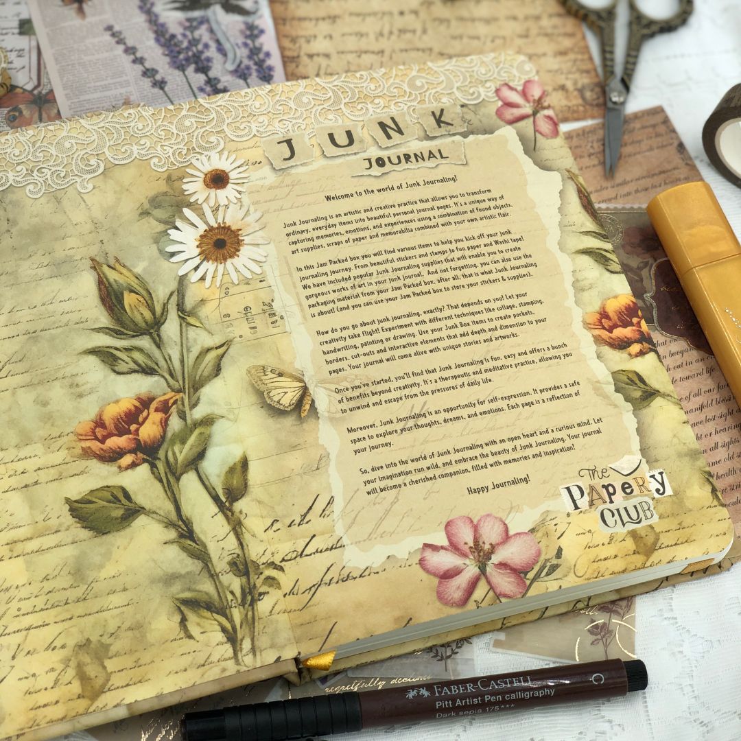 Decorative junk journal with floral designs , matching end paper and text, featuring a Faber-Castell pen.