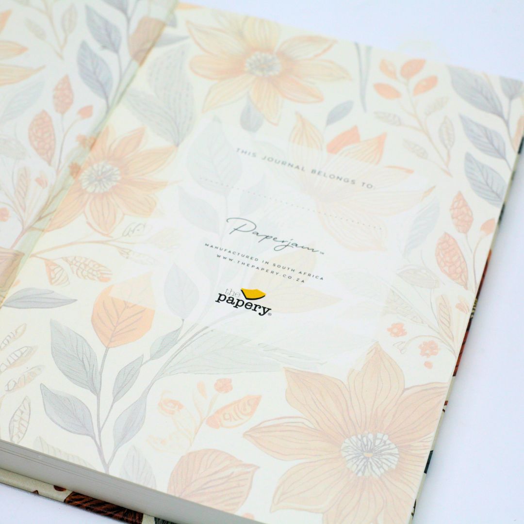 Personalization features of premium hardcover dotted journal with autumn garden design on a white background