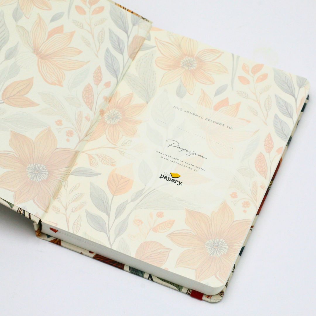 End papers of premium hardcover dotted journal with autumn garden design on a white background on a white background