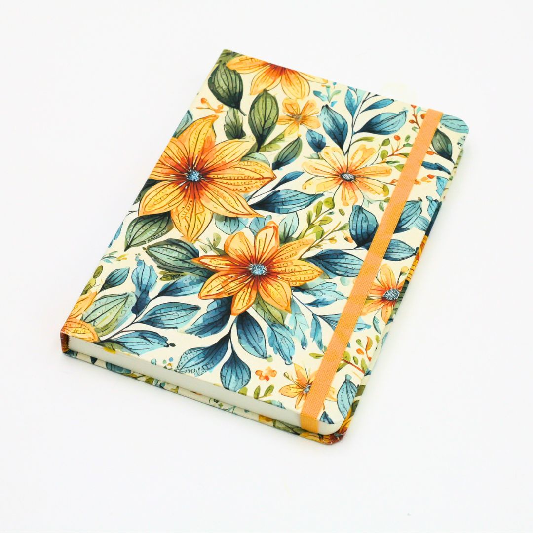 Front cover of premium hardcover dotted journal with summer garden design on a white background