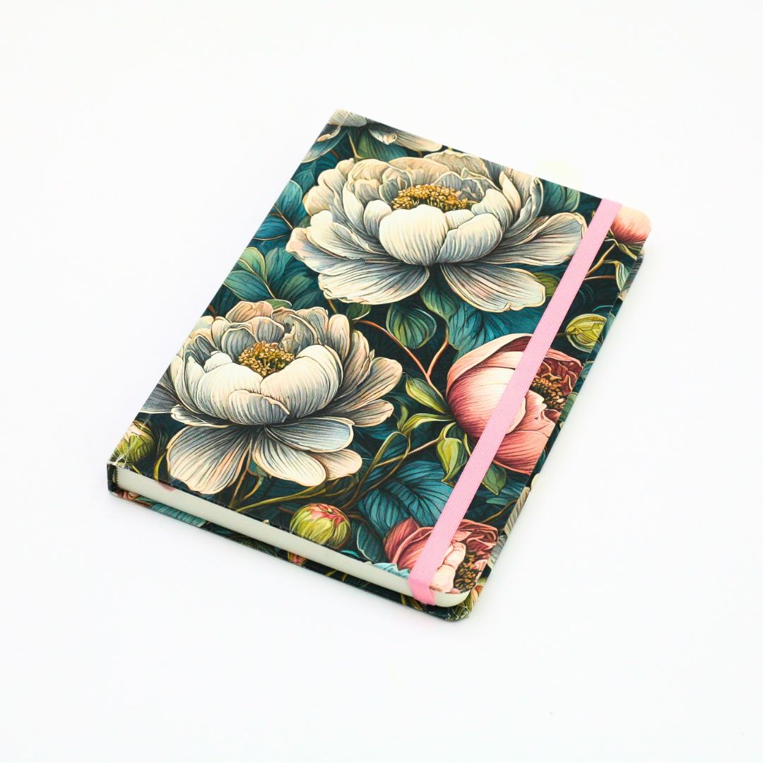 Front cover of premium hardcover dotted journal with vintage peonies design on a white background
