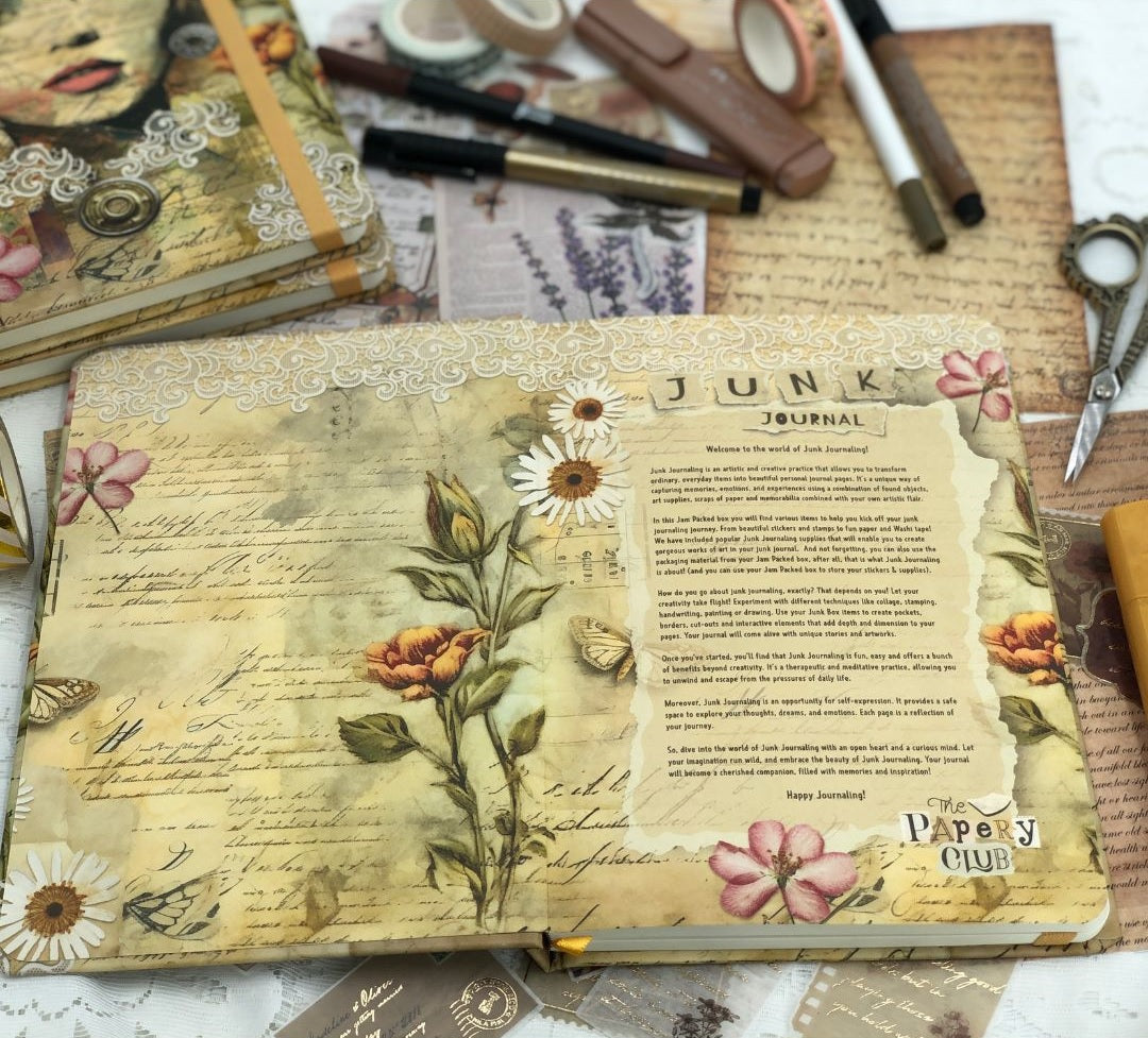 Decorative Junk Journal with floral and text design on a textured surface