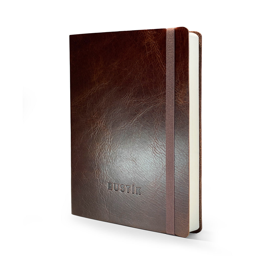 Rustik Premium dotted Journal in brown leather with matching ribbon on a white background