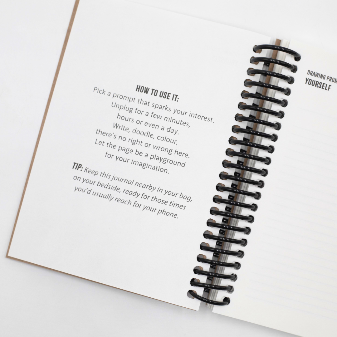Open Digital Detox Reset Journal with a spiral binding on a white background