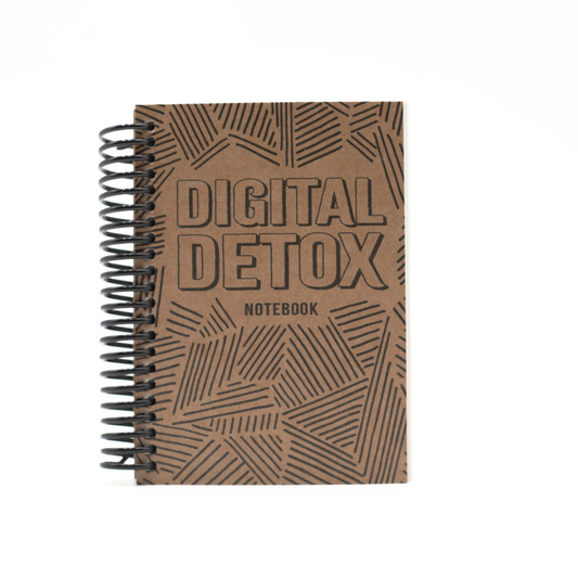 Brown Digital Detox Reset Journal notebook with 'Digital Detox' text on a white background