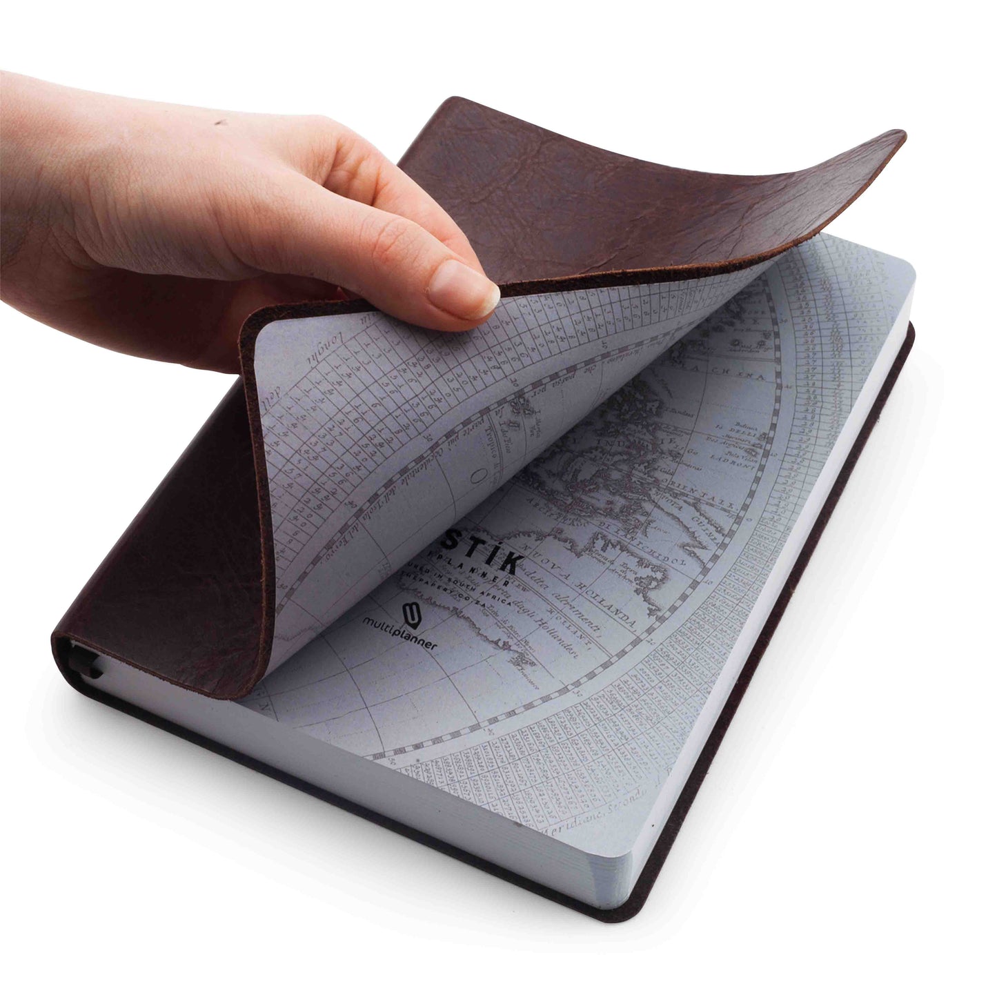 A premium Rustik Flexi MultiPlanner in genuine leather with end papers and featuring the map inside the pages on a white background