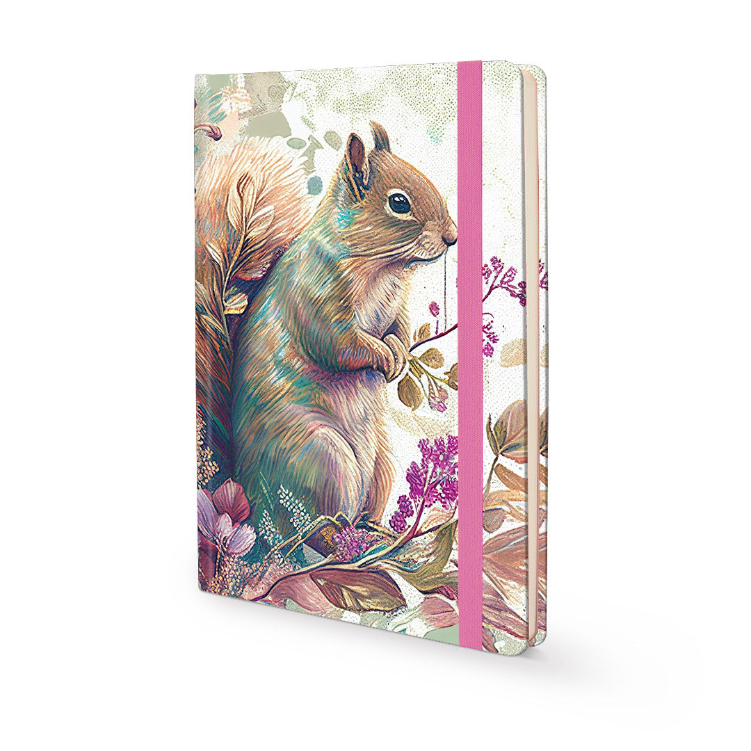 A hardcover notebook featuring a detailed illustration of a brown and gray squirrel surrounded by purple flowers and leaves on a cream background, with a pink elastic closure band.