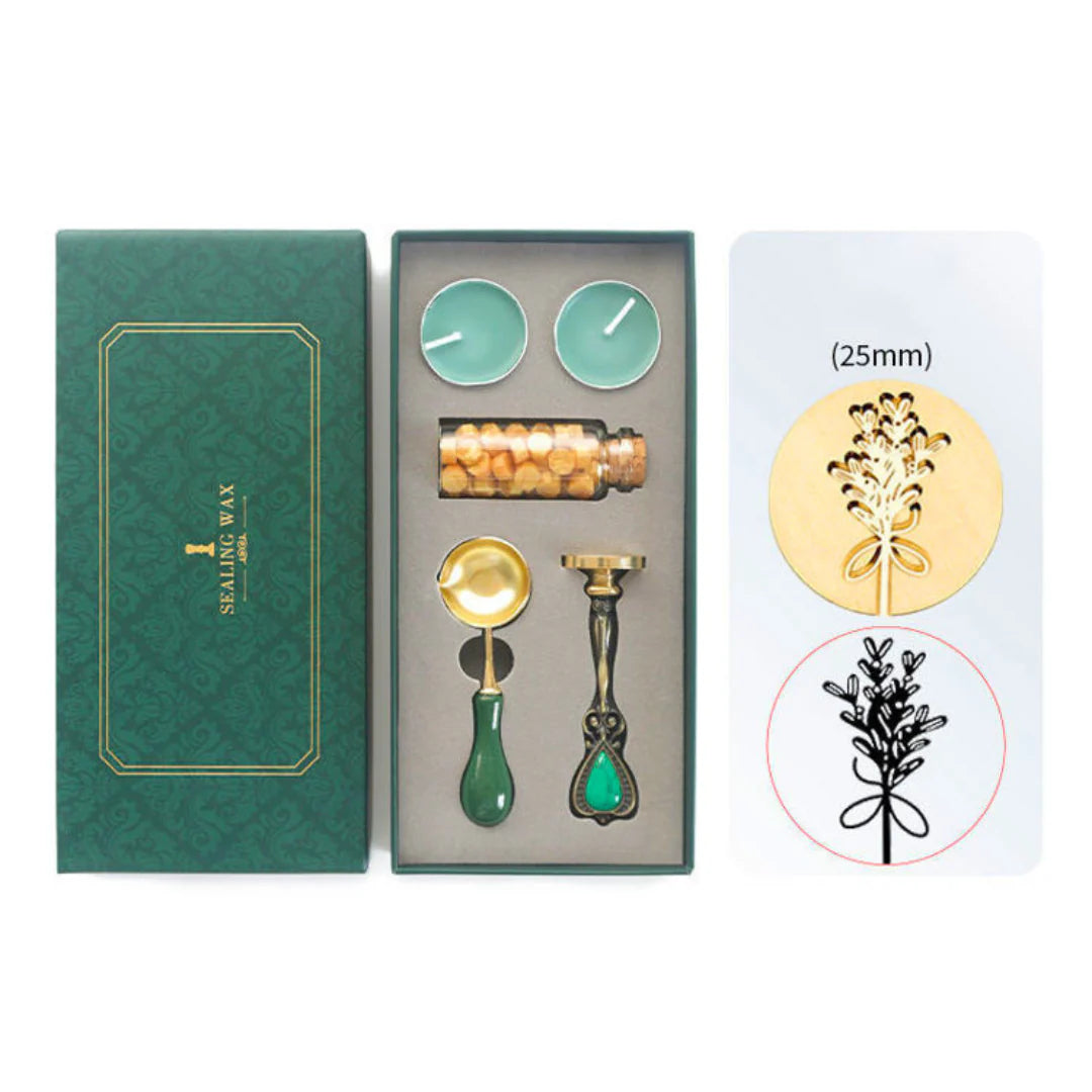Sealing Wax Set of lavender decorative items including a bottle, candles, and a stamp in a green box with a white background.