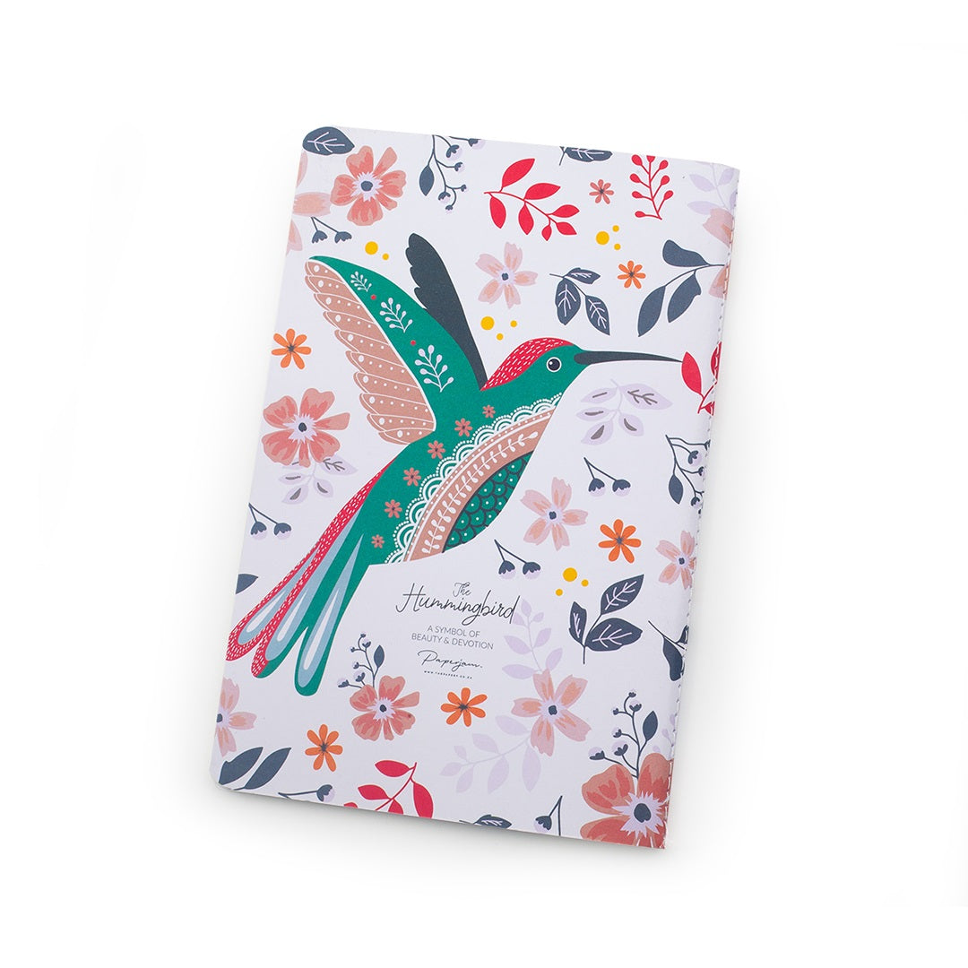 Notebook with a colorful design of a white hummingbird and flowers on a white background