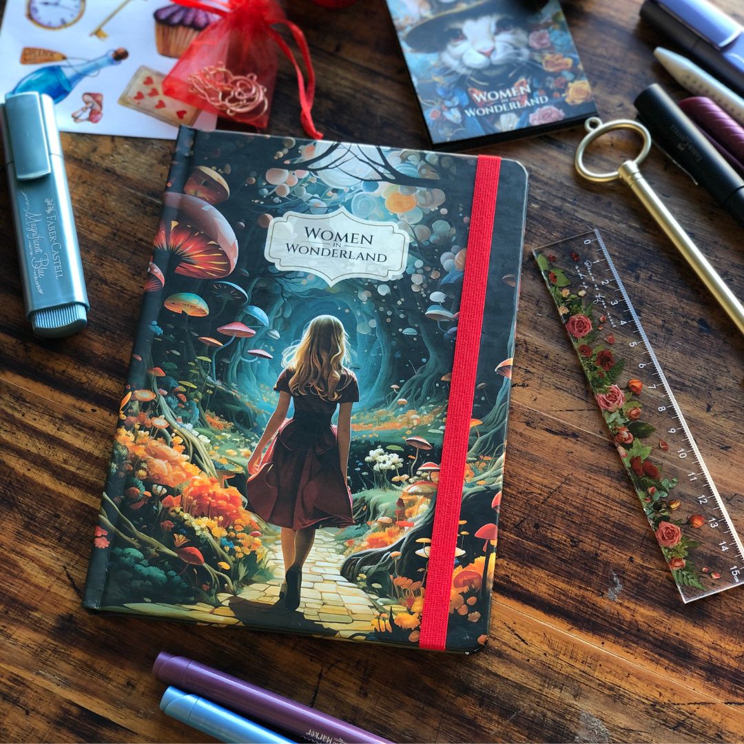 Retro Women in Wonderland Journal with a colorful design on a wooden surface with stationery items.