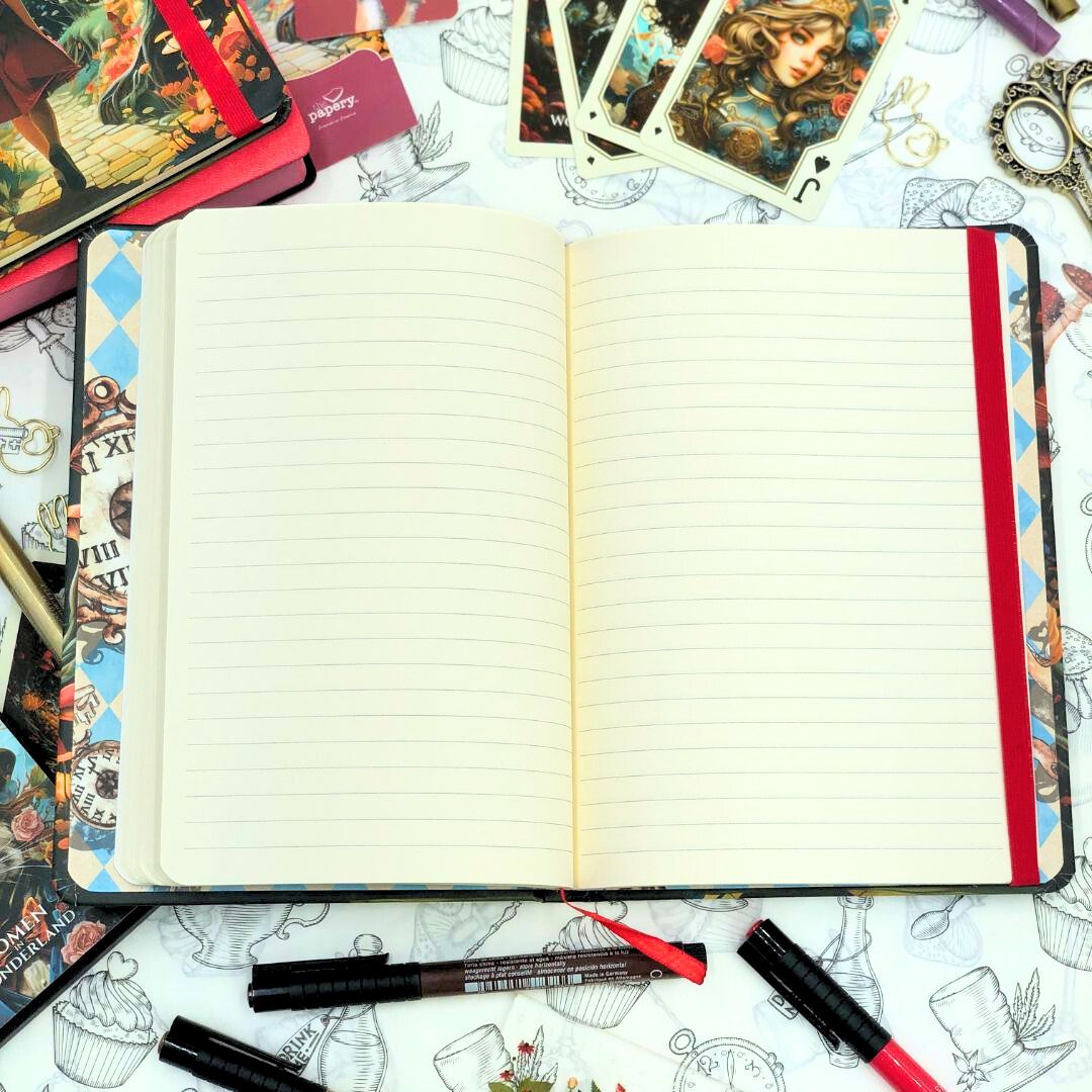 Open Retro Women in Wonderland Journal with lined pages on a decorative surface with tarot cards and pens.